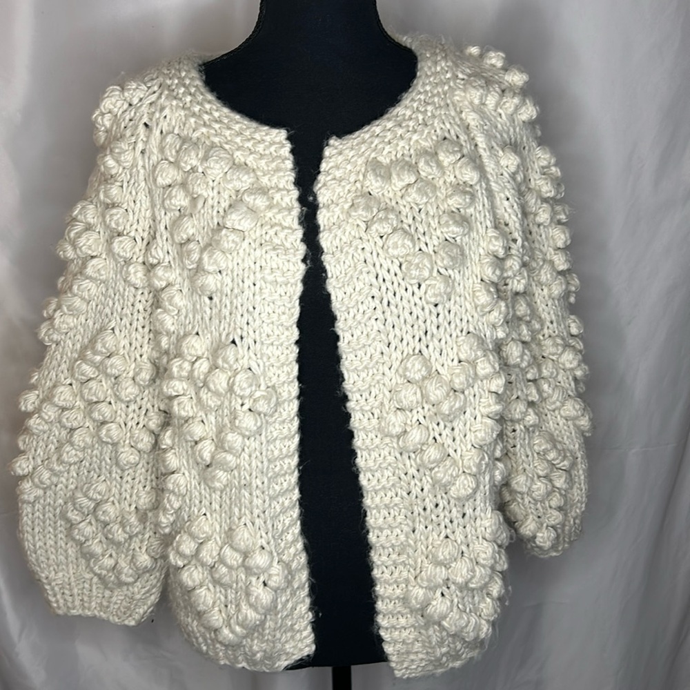 GLAM cream colored acrylic/wool cardigan. Pom pom design all over. Size Small.